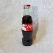 2006 Coca-Cola 8 oz Full Unopened Coke Green Glass Bottle Santa Claus Christmas