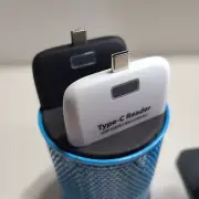 Multifunctional 4 in 1 Type-C Reader with Micro SD TF, SD, and Micro USB Ports.
