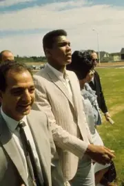 Muhammad Ali walking with his trainer Angelo Dundee and wife Sonji- Old Photo