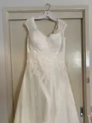 Wedding Dress size 12-16 tried in but never worn.