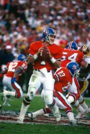 Quarterback John Elway Denver Broncos drops back to pass v W- Football Photo 1