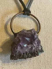 Amethyst holistic stone on a metal ring, black leather adjustable curd necklace.