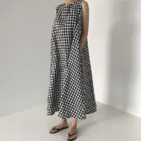 在飛比找Yahoo奇摩購物中心優惠-MOCO黑白格子大擺裙棉麻背心洋裝M~XL