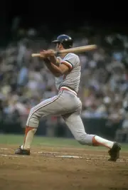 Mark Belanger Baltimore Orioles swings and watches the flight of - 1974 Photo