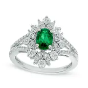 Oval Lab-Created Emerald and White Sapphire Starburst Frame Ring in Sterling Silver