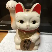 Maneki Neko Lucky Cat holding a sign that says BLESSING