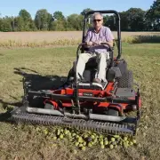 Swinging Tool Bar and Rake Ezra Lawn Care Equipment mounts on a zero turn mower