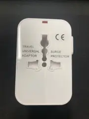 International travel adaptor with C/ USB ports, Complies with part 15 FCC Rules.