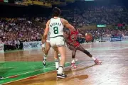 Michael Jordan Chicago Bulls makes a move againt Scott Wedman Bost- Old Photo