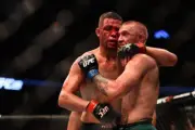 Nate Diaz shakes hands wih Conor McGregor after UFC 202, 2016 7x5 Photo