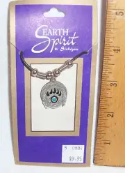 PEWTER BEAR PAW SHIELD PENDANT ON ADJUSTABLE BLACK CORD W/SILVER COLOR ACCENTS