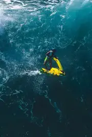 Surfer Herbie Fletcher Rides A Wave On A Jet Ski1980s Surfing Photo