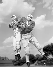 Rugby Players Trying to Catch Ball, Low Angle View Poster Print (18 x 24)