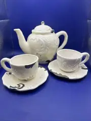 Bella Casa By Ganz Off White With Shiny Silver Teapot With Cups And Saucers