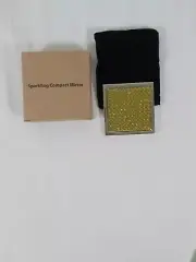 AVON, VINTAGE SPARKLING COMPACT MIRROR NEW IN BOX, GOLD WITH A LITTLE BLACK BAG