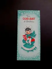 L762 VTG Unused Glitter Xmas Greeting Card Mid Century Lady in Green W/ Presents