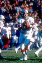 Quarterback Jim Plunkett New England Patriots drops back to pass - 1974 Photo