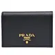 PRADA 經典品牌金色浮雕LOGO防刮牛皮暗釦短夾(黑)