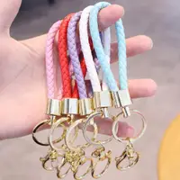 在飛比找ETMall東森購物網優惠-男女士手工編織皮繩鑰匙扣圈汽車鑰匙圈鑰匙學生情侶掛件飾品禮物