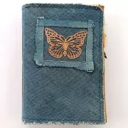 handmade junk journal with blue denim cover grungy paint pages