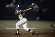 Outfielder Hank Aaron swings and watches the flight of his ball a- 1974 Photo