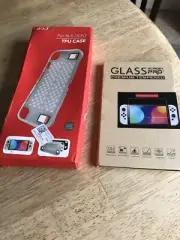 Nintendo Switch OLED silicone case brand new in box and OLED tempered screen New