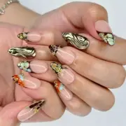 Elegant Animal Print Almond Press On Nails with Gold Accents & 3D Floral Touch