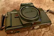 Minolta X-370, 35mm Film SLR Camera. NEW / without box. Minolta shoulder strap.