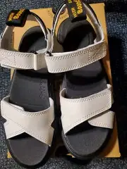 NIB Doc Martens Vossie Y White/ Black Sandals. Youth Girls 6. Youth Boys 5.