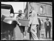 Two men carrying a large box of bank notes being transferred from - Old Photo