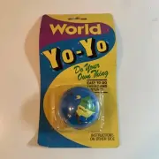 NEW OLD STOCK VINTAGE WORLD GLOBE SHAPED YO-YO IN ORIGINAL PACKAGE, PARTIAL OPEN