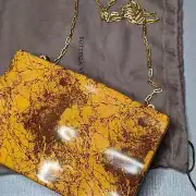 BOTTEGA VENETA leather covered hard side crossbody or clutch, huge $5000.