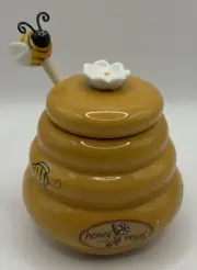 Honey pot with a bee dipper
