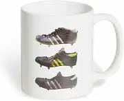 The design features three beautifully weathered vintage Rugby football boots, last worn in the 1970s. The mug comes packaged in a protective cardboard box and is dishwasher and microwave safe.