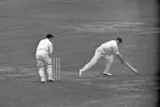 The Army wicket keeper Keith Andrew sends bails into air whilst at- Old Photo