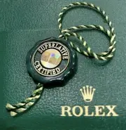 Authentic Rolex Officially Certified Superlative Chronometer Green tag