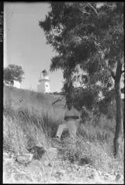 NSW Man on hill below lighthouse Manly Sydney New South Wales - Old Photo
