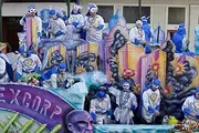 Revelers over a skyline float for Mardi Gras Mardi Gras began in Mobile Alabama in 1703 when it was a colony of French soldiers Colorful beads and Moon Pies (two large cookies with marshmallow in betw