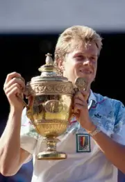 Stefan Edberg of Sweden poses with the trophy after defeating Bori- Old Photo