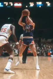 Don Buse Phoenix Suns looks to pass the ball over the top of Earl - Old Photo