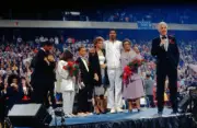 Philadelphia 76ers Julius Erving stands on stage with his family d- Old Photo