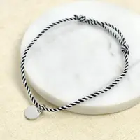 在飛比找momo購物網優惠-【men life】白鋼手鍊 可調編織繩圓牌手環(編織手環)