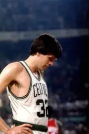 Kevin McHale Boston Celtics looks down while on the court during a- Old Photo