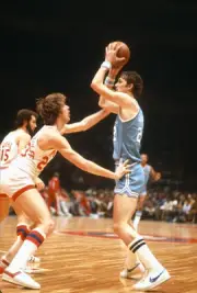 Gus Gerard Buffalo Braves looks to pass the ball over the top of J- Old Photo