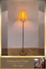 Floor lamp, art deco lamp, a floor lamp with a golden shade.