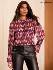 Love & Roses Red And Purple Chevron Print Plisse Mesh Long Sleeve Jersey Blouse (AD6978) | $55
