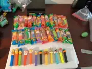 35 Old Pez W/Simpsons, Looney Tunes, Disney Mickey & friends Most are sealed