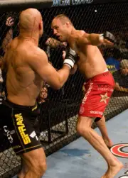 Randy Couture punches Mike Van Arsdale at UFC 54, 2005 7x5 Photo