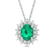 Oval Lab-Created Emerald and White Sapphire Sunburst Frame Pendant in Sterling Silver
