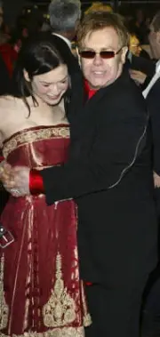 Renee Zellweger and musician Elton John arrive at the UK Gala Pre- 2004 Photo 2